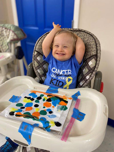 baby with finger paints
