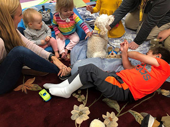 kids playing with a dog